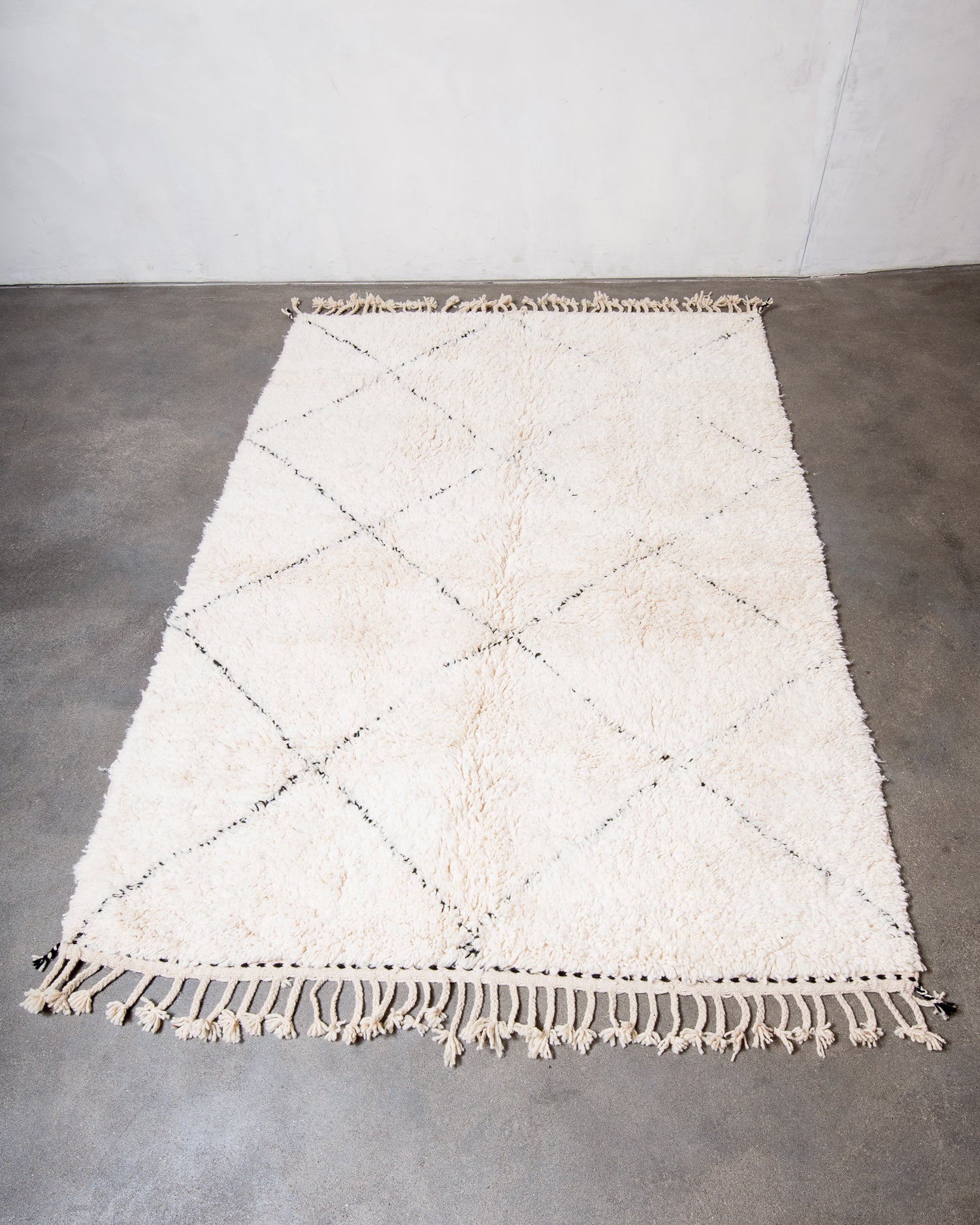 Modern, designer, handcrafted Berber rug from Morocco. Beniourain carpet with minimalist design, natural wool pile and a fluffy texture.